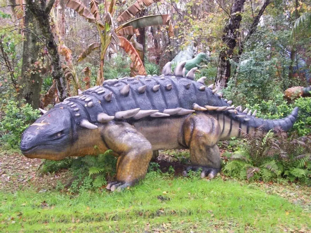 A dinosaur in the bushes